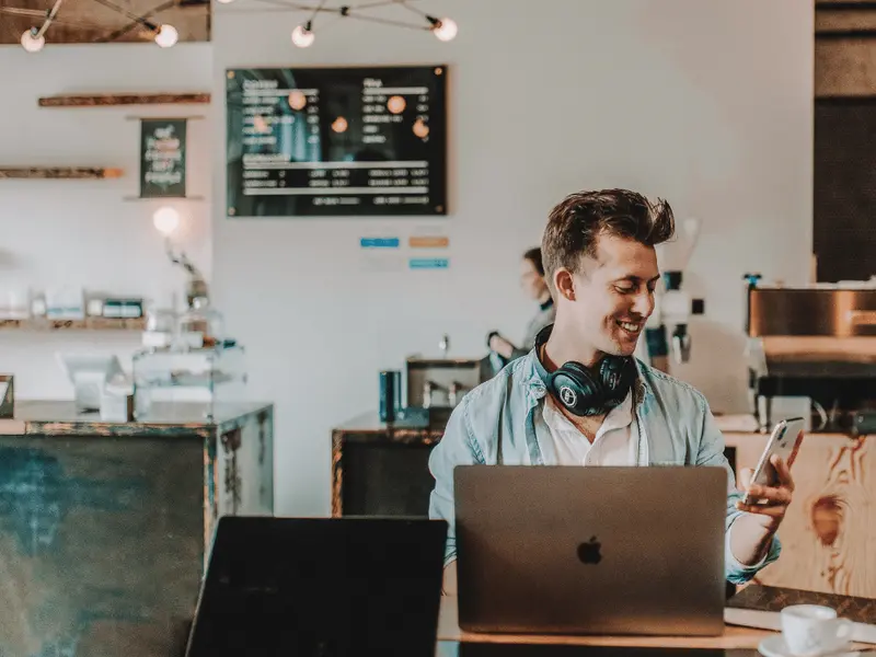 A freelancer looking at the phone